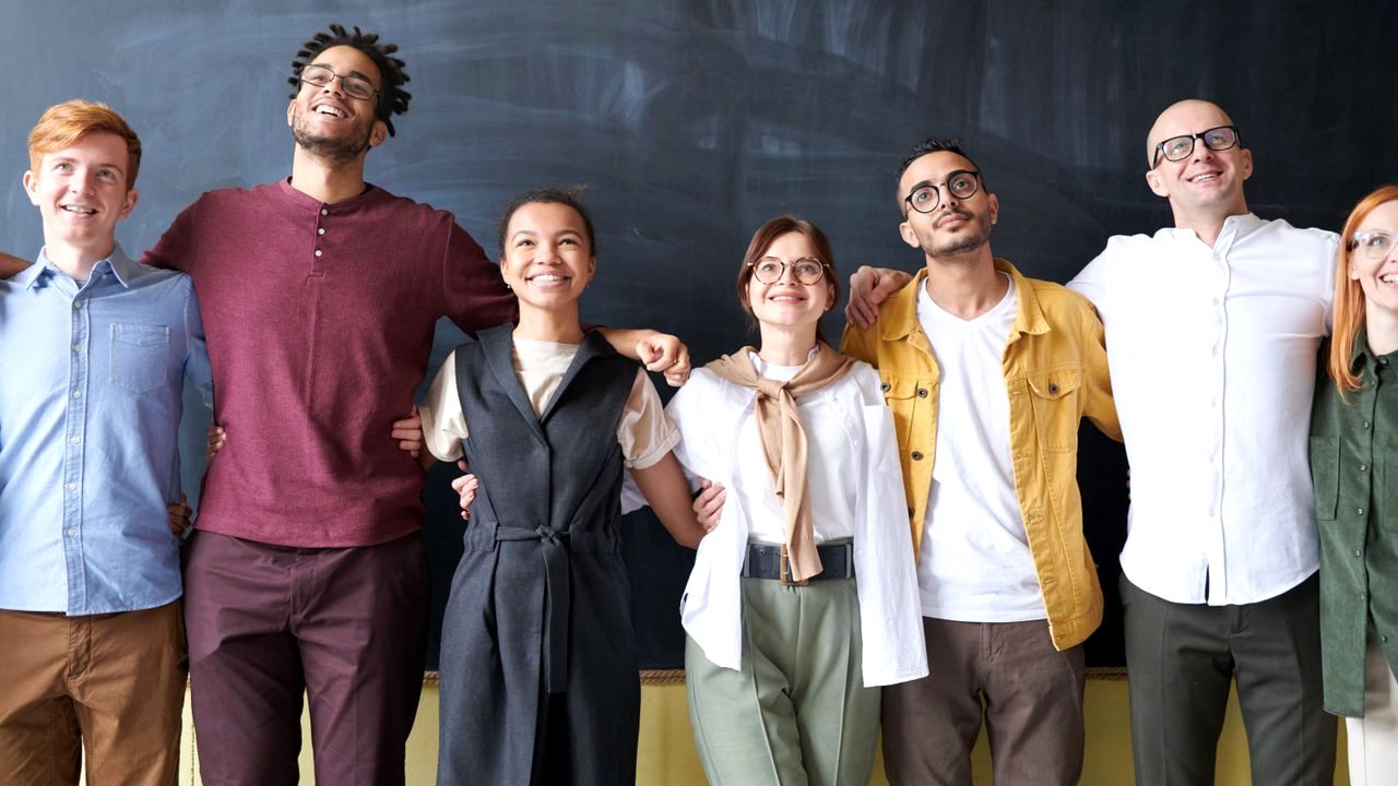 Diverse multi-person group photo cleanup preview with natural faces preserved