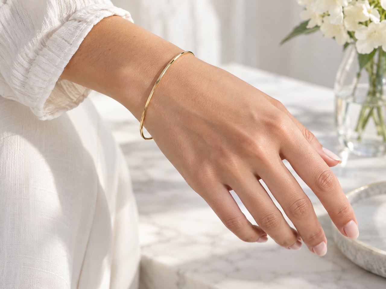 Jewelry showcase sample for ChatGPT Prompt for Jewelry on Hand Model (Bright Airy) (style concept; not an end-user likeness)